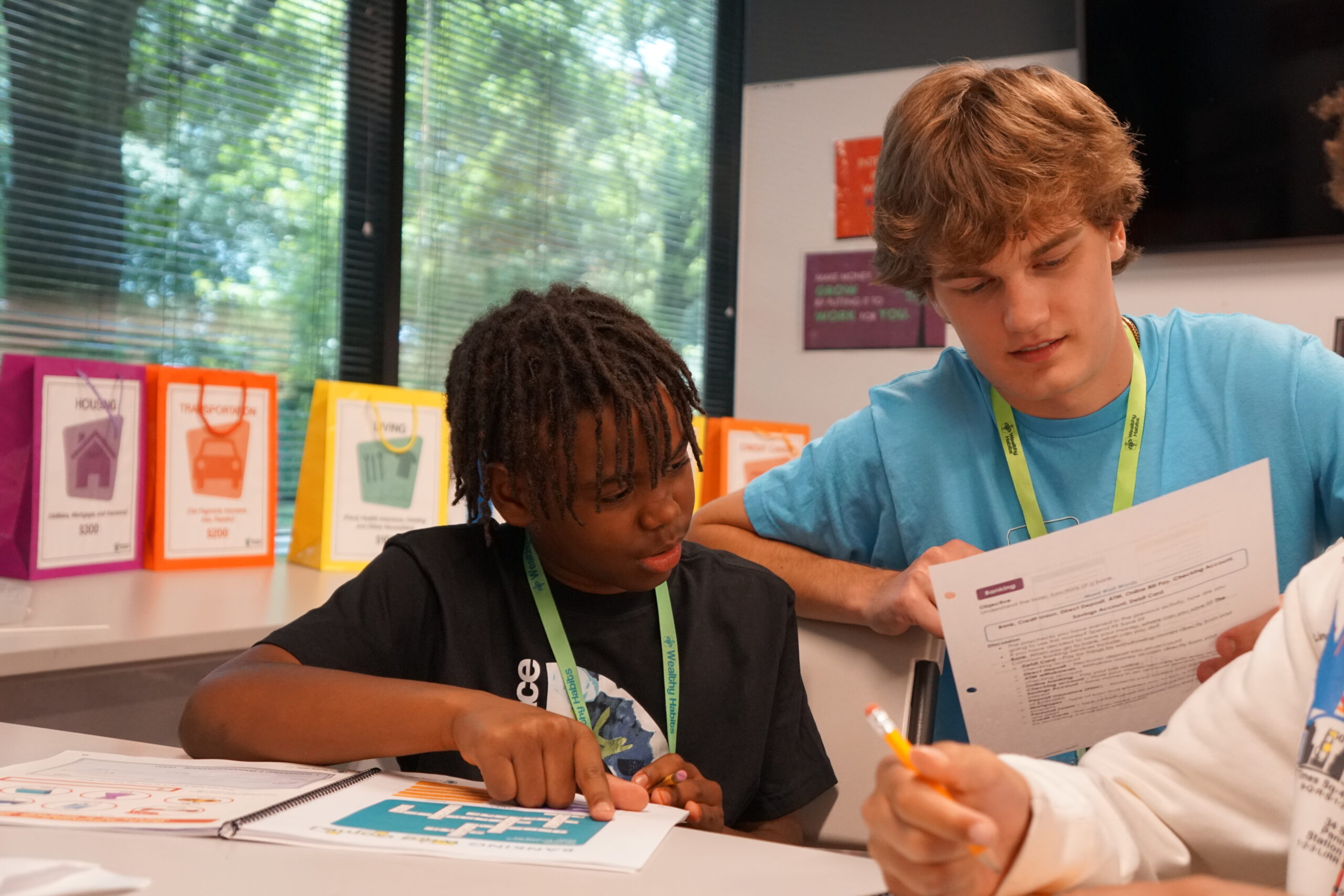 Intern guiding students at Summer Camp 2023 At Wealthy Habits.